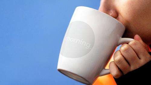 Woman drinking a hot drink out of a mug mockup - 2042622