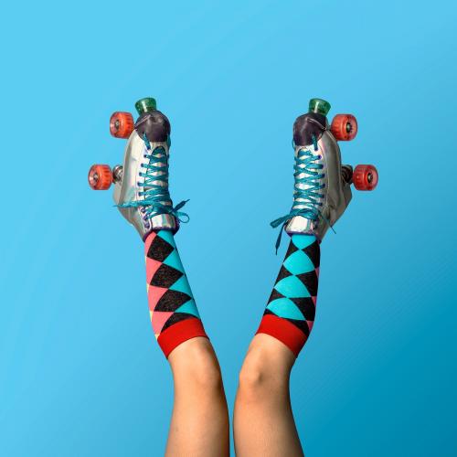 Legs in a roller skates shoes with blue background mockup - 2053018