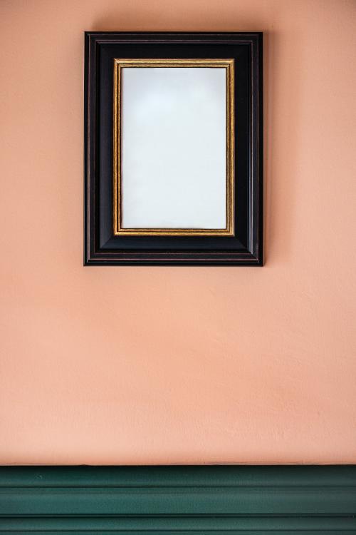 Black frame against a peach wall - 1231180