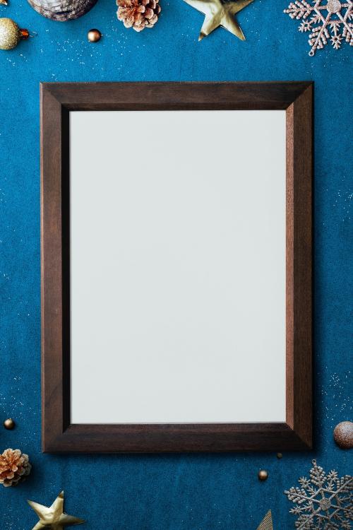 Wooden frame mockup with Christmas decorations on blue background - 1232335