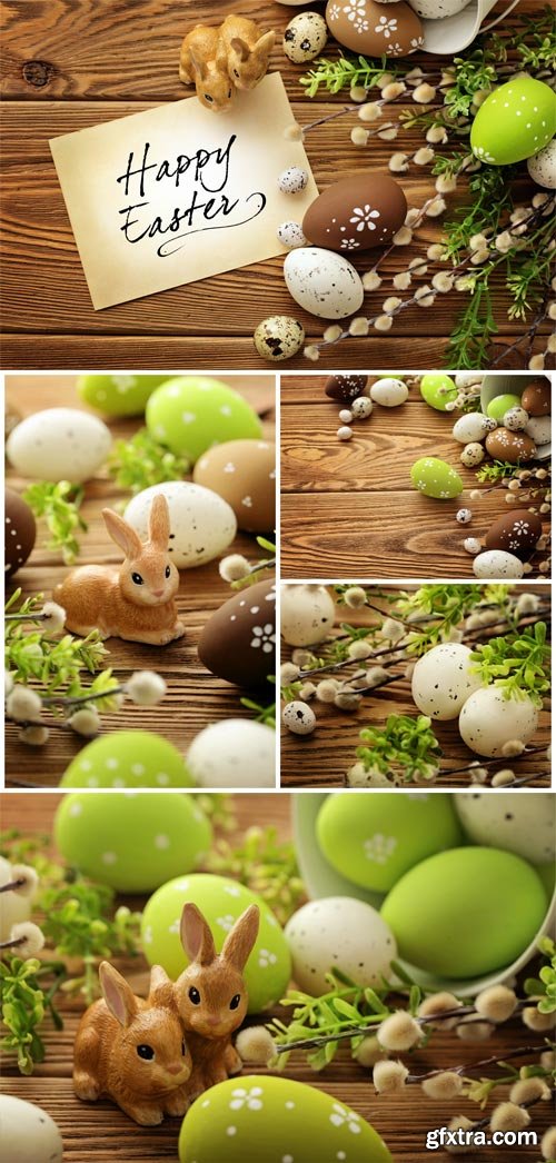 Easter bunnies and vine branches on wood background stock photo