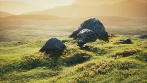 Videohive - Meadow with Huge Stones Among the Grass on the Hillside at Sunset - 32338047 - 32338047