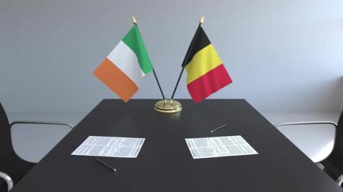 Videohive - Flags of Ireland and Belgium on the Table - 32332280 - 32332280