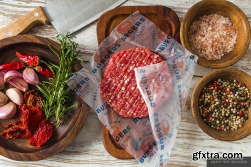 Hamburger raw meat wrapping paper olives jar Food on the table mockup