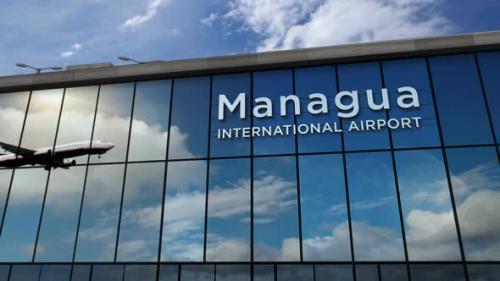 Videohive - Airplane landing at Managua Nicaragua airport mirrored in terminal - 32426839 - 32426839