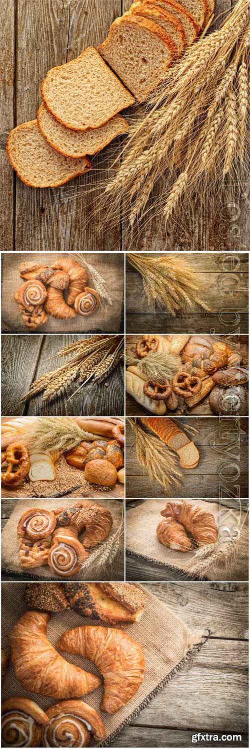 Bread, spikelets and pastries on wood background stock photo