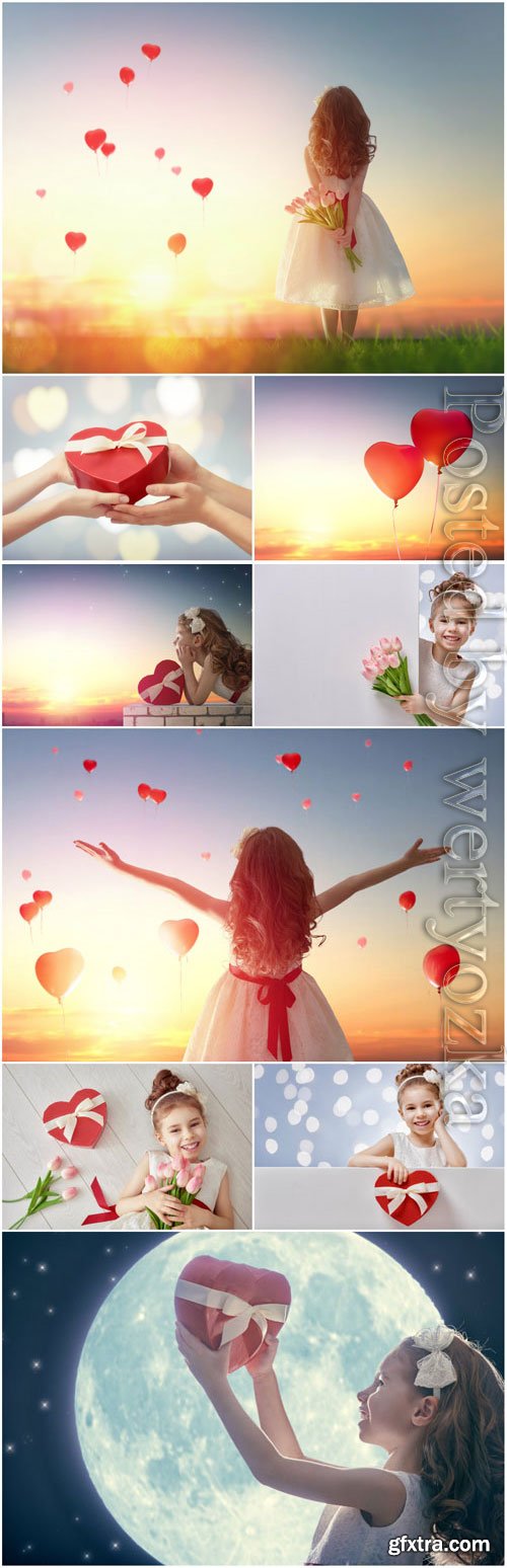 Little girl with air red heart stock photo