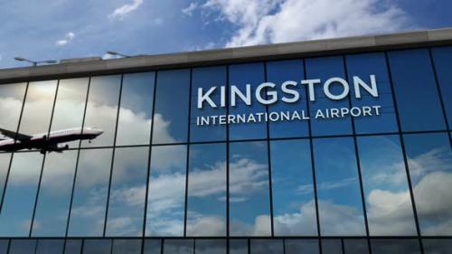 Videohive - Airplane landing at Kingston Jamaica airport mirrored in terminal - 32487789 - 32487789