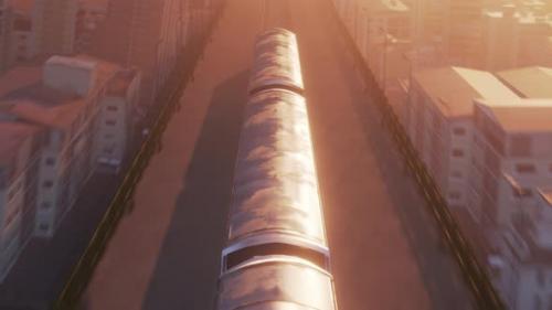 Videohive - Aerial View of Train in Warm Sunset Light Passing Through City - 32581123 - 32581123