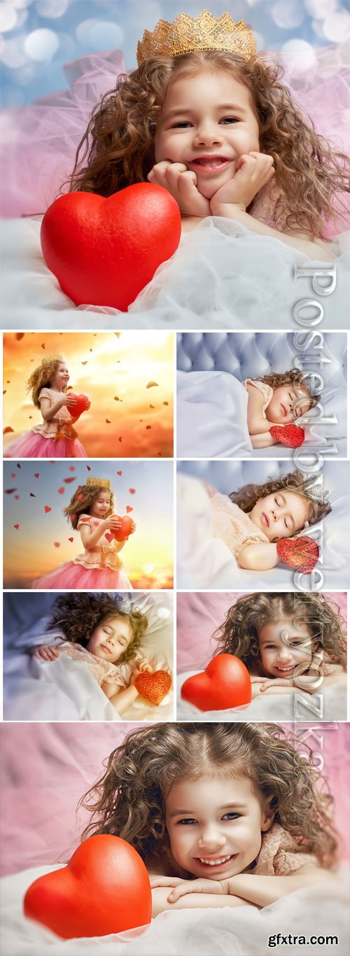 Curly girl with red heart stock photo