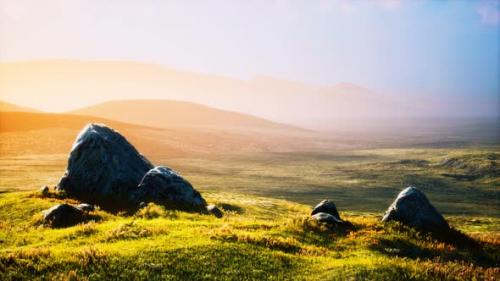 Videohive - Meadow with Huge Stones Among the Grass on the Hillside at Sunset - 32700098 - 32700098