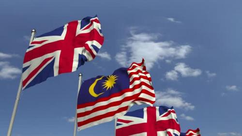 Videohive - Flags of Malaysia and the United Kingdom Against Blue Sky - 32774124 - 32774124