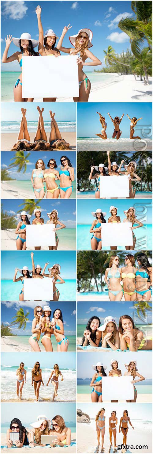 Young girls with white placard at the sea stock photo