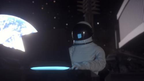 Videohive - Astronaut Works on His Science Laptop in a Space Colony on the Moon - 32892371 - 32892371