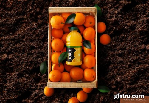 Orange juice bottle over oranges box