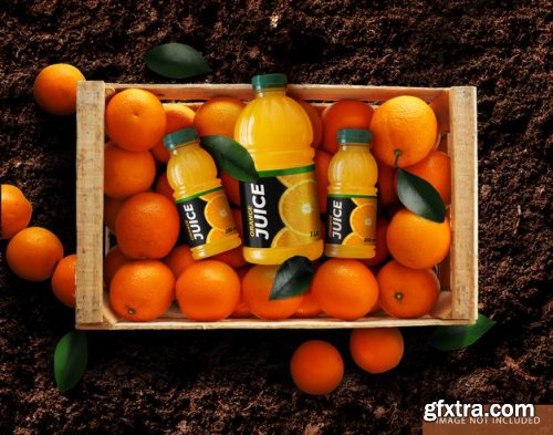 Orange juice bottle over oranges box