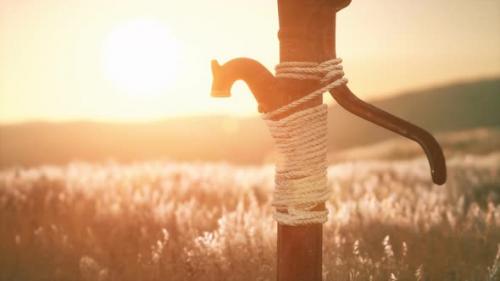 Videohive - Old Hand Water Pump on Dry Hills - 32988598 - 32988598