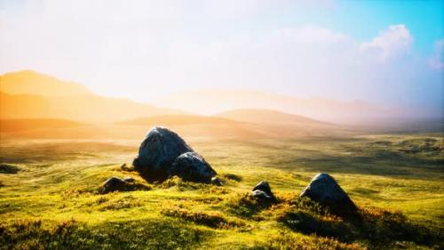 Videohive - Meadow with Huge Stones Among the Grass on the Hillside at Sunset - 32988798 - 32988798