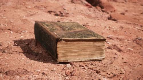 Videohive - Old Book in Red Rock Desert - 32990645 - 32990645