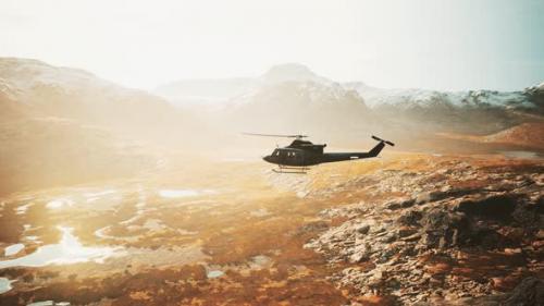 Videohive - Slow Motion Vietnam War Era Helicopter in Mountains - 33100532 - 33100532
