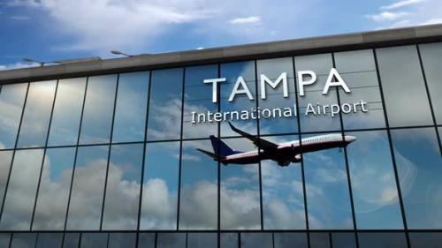 Videohive - Airplane landing at Tampa Florida, USA airport mirrored in terminal - 33108941 - 33108941