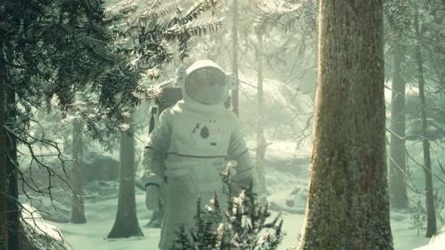 Videohive - Astronaut Exploring Forest in Snow - 33166626 - 33166626