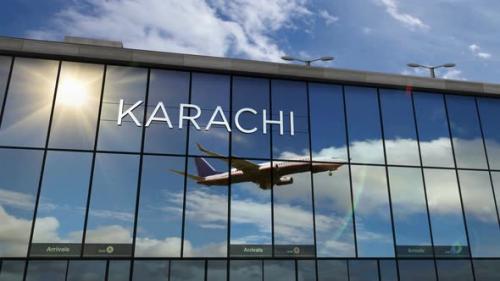 Videohive - Airplane landing at Karachi Pakistan airport mirrored in terminal - 33177553 - 33177553