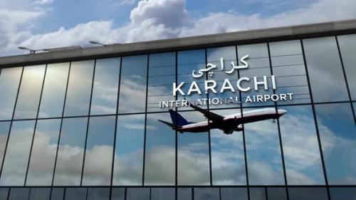 Videohive - Airplane landing at Karachi Pakistan airport mirrored in terminal - 33177555 - 33177555