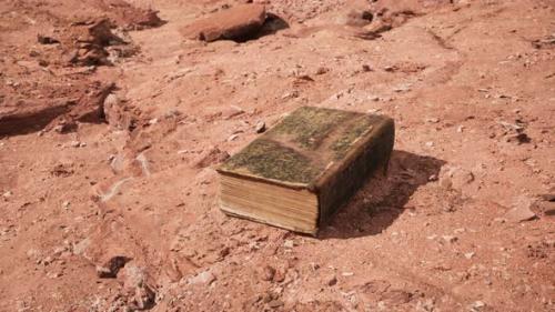 Videohive - Old Book in Red Rock Desert - 33134330 - 33134330