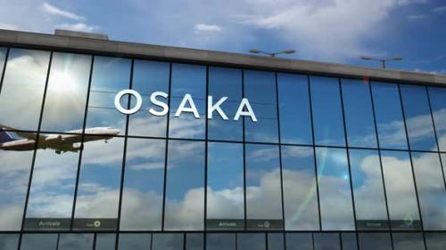 Videohive - Airplane landing at Osaka Japan airport mirrored in terminal - 33234233 - 33234233