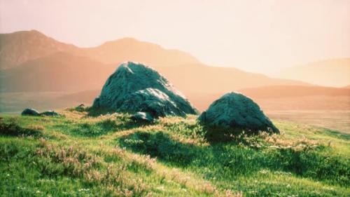 Videohive - Meadow with Huge Stones Among the Grass on the Hillside at Sunset - 33326894 - 33326894