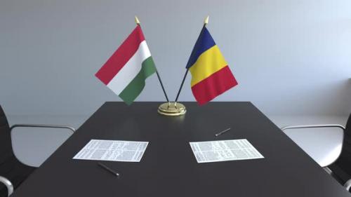 Videohive - Flags of Hungary and Romania and Papers on the Table - 33386797 - 33386797