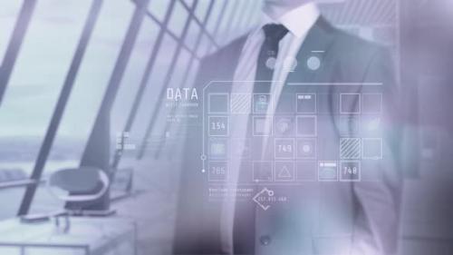 Videohive - Businessman Browses Corporate Data And Modern Office Background 4K - 33620455 - 33620455