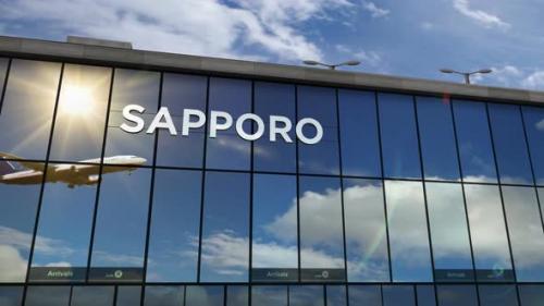 Videohive - Airplane landing at Sapporo Japan airport mirrored in terminal - 33661321 - 33661321