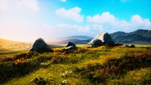 Videohive - Meadow with Huge Stones Among the Grass on the Hillside at Sunset - 34249490 - 34249490