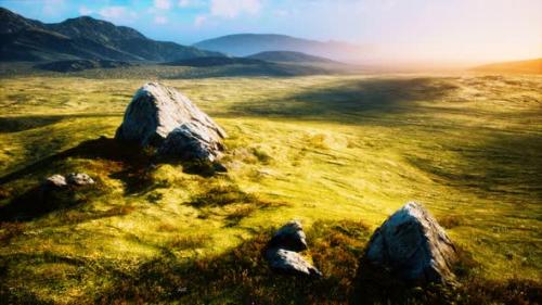Videohive - Meadow with Huge Stones Among the Grass on the Hillside at Sunset - 34328679 - 34328679