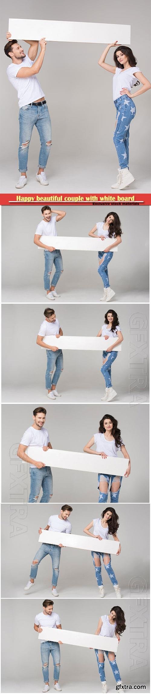 Young couple in jeans hold a white poster