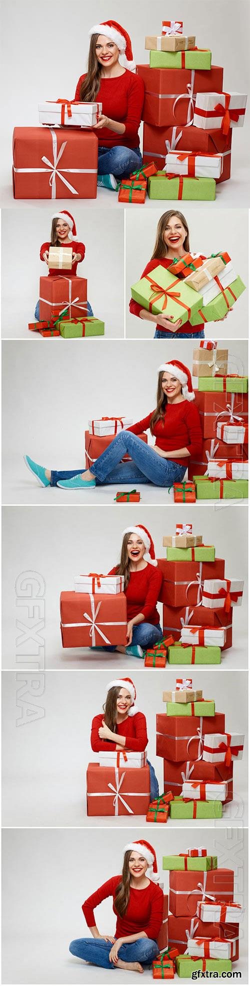 Girl near christmas boxes with gifts stock photo