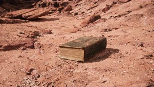 Videohive - Old Book in Red Rock Desert - 34949272 - 34949272