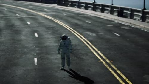 Videohive - Astronaut Walks in the Middle of a Road - 35266737 - 35266737