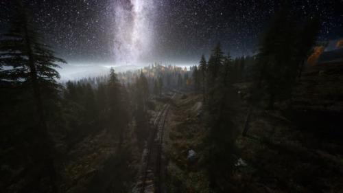 Videohive - The Milky Way Above the Railway and Forest - 35325066 - 35325066