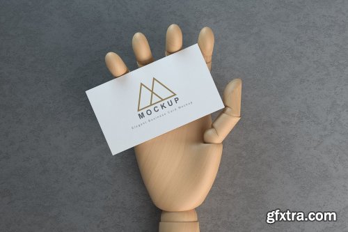 Business Card in Wooden Hand Mockups