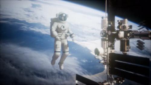 Videohive - International Space Station and Astronaut in Outer Space Over the Planet Earth - 35536148 - 35536148