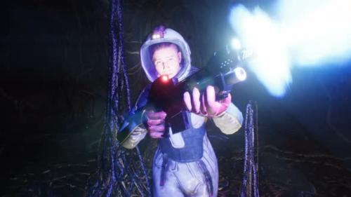 Videohive - An Astronaut With A Blaster Sneaks Through A Cave - 35478171 - 35478171