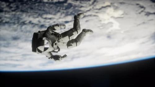 Videohive - Dead Astronaut Leaving Earth Orbit Elements of This Image Furnished By NASA - 36343220 - 36343220