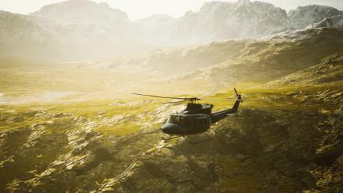 Videohive - Slow Motion Vietnam War Era Helicopter in Mountains - 36343472 - 36343472