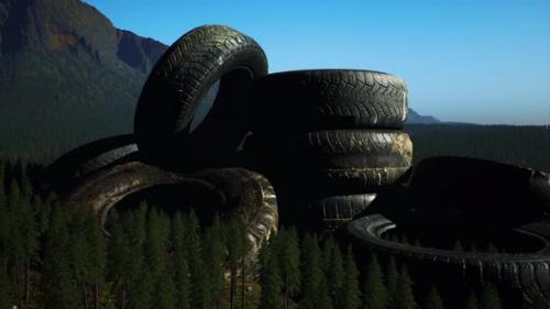 Videohive - Concept of Environmental Pollution with Big Old Tires in Mountain Forest - 36633612 - 36633612