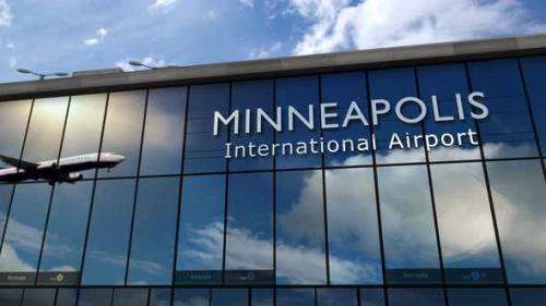 Videohive - Airplane landing at Minneapolis Minnesota, USA airport mirrored in terminal - 36638169 - 36638169