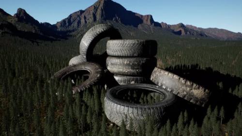 Videohive - Concept of Environmental Pollution with Big Old Tires in Mountain Forest - 36736342 - 36736342