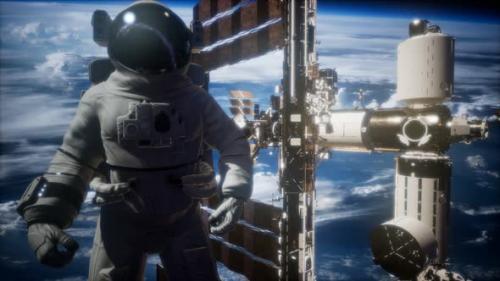 Videohive - International Space Station and Astronaut in Outer Space Over the Planet Earth - 36739067 - 36739067